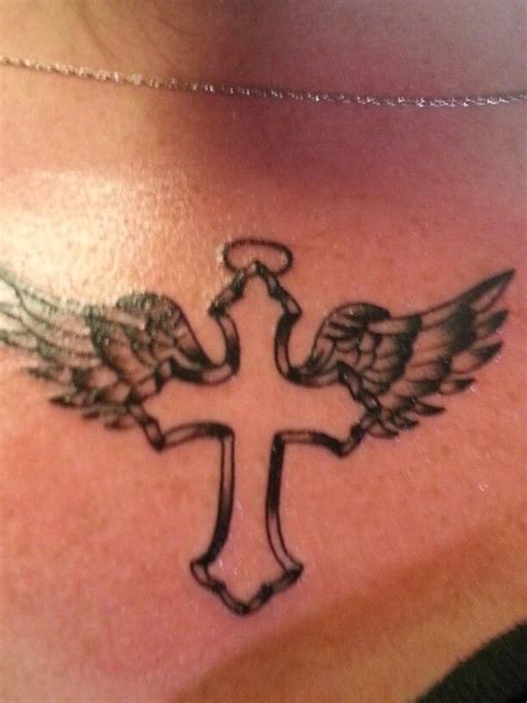 Custom cross and angel wings tattoo by Sammy Angel wings