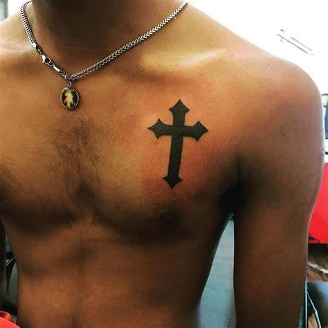 Unleash Your Inner Rebel with a Cross Tattoo on Your Chest: The Ultimate Expression of Faith and Courage!