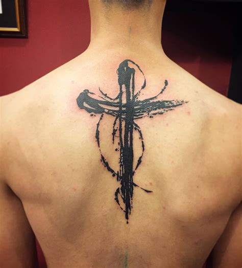 Cross Tattoo In The Back