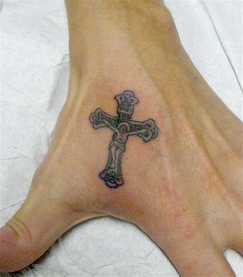 30 Superb Cross Tattoos On Hand