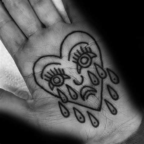 Crying heart face traditional blackwork tattoo
