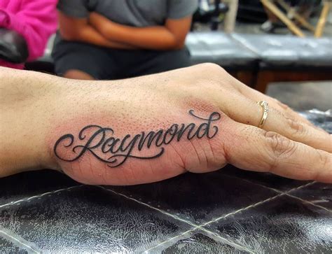 Cursive Tattoo On Hand