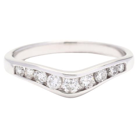 Eternally Effervescent: Unearthing Sparkles and Love in a Curved Diamond Wedding Ring