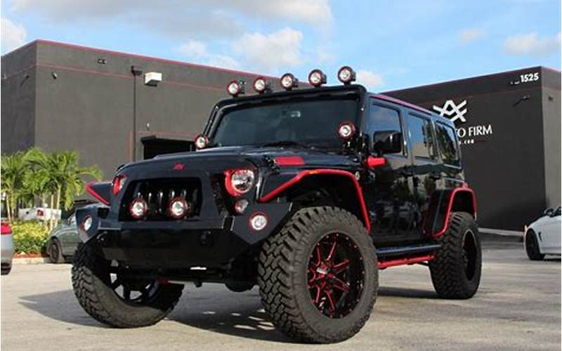 Customized Black Jeep With Red Accents