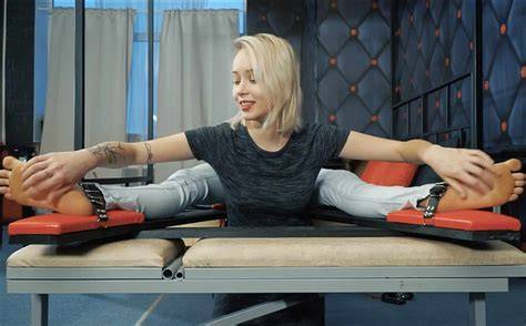 A professional film set in the Czech Republic designed for tickling content, featuring soft lighting and a bed.