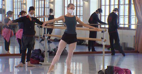 Dancers Rehearse In Masks With