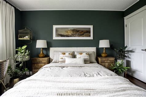 Dark green accent wall in bedroom