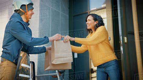 Delivery person handing food to customer