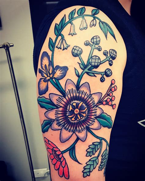 flowers and waves! Done by Zach stuka of deluxe tattoo in