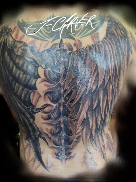 Fearful demon with great wings tattoo on back Demon