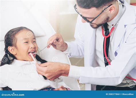 Dentist examining a child's teeth