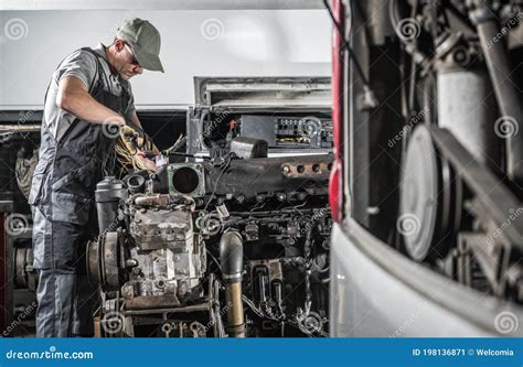Diesel Mechanic Working on a Heavy Machine