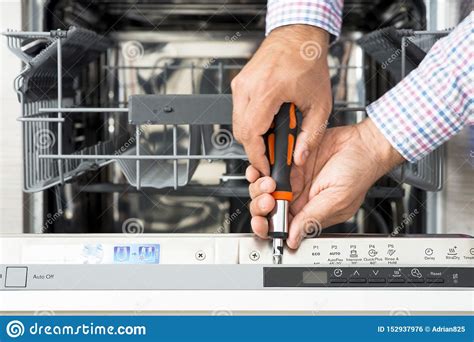 Dishwasher technician checking the machine