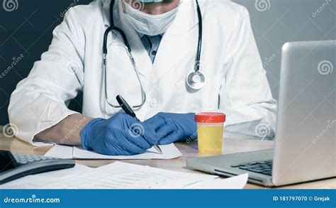 Doctor examining urine sample