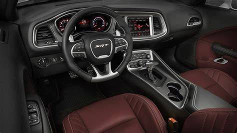 Dodge Challenger interior features showcasing modern tech in a Dodge vs Ford Mustang comparison