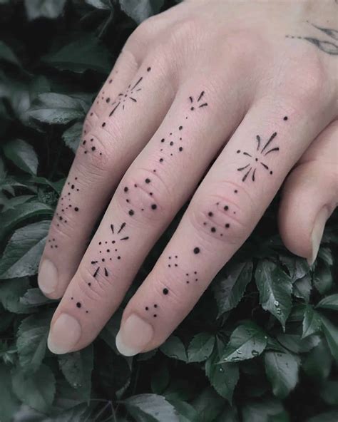 Dotted Finger Tattoo
