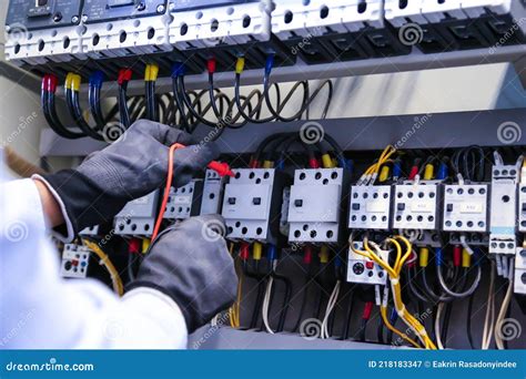 Electrical repair technician checking wiring