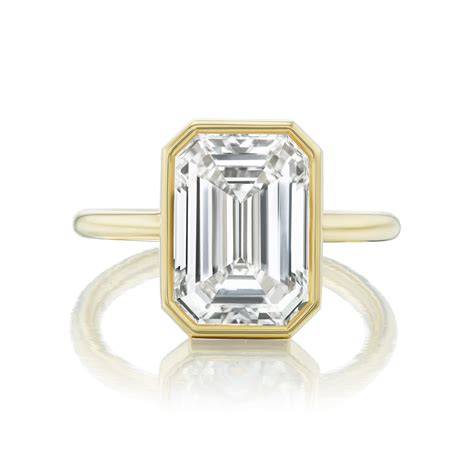 Emerald Cut Diamond Ring Secured in a Sleek Bezel Setting