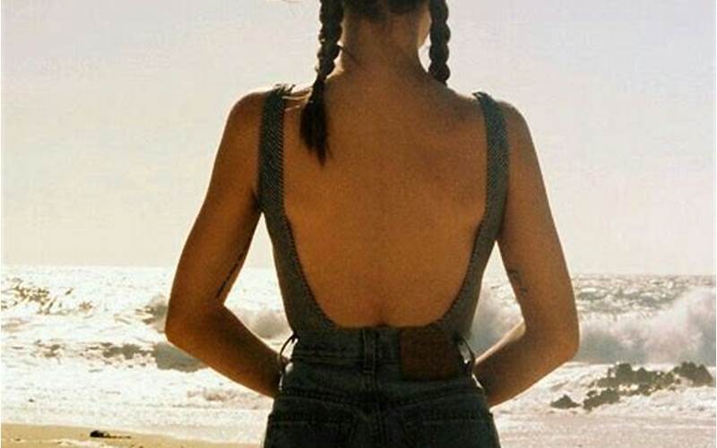 Emily Browning In A Classic Black Bikini On The Beach.