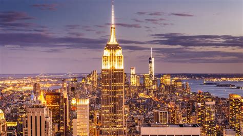 A panoramic view of the illuminated Empire State Building at night
