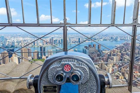 A panoramic view from the observation deck of the Empire State Building, showing the city skyline stretching out in all directions