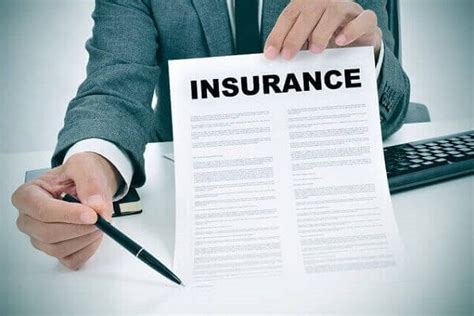 Employee holding insurance papers