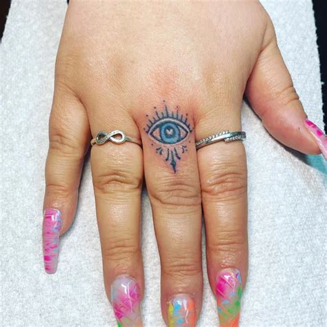 Evil Eye Finger Tattoo