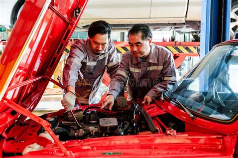 Expert Technician Examining Car Engine