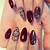 Exude Confidence: Dark Red Nail Designs for Powerful, Fashion-Forward Women