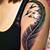 Feather With Birds Flying Out Tattoo