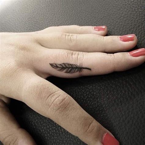 Feather On Finger Tattoo
