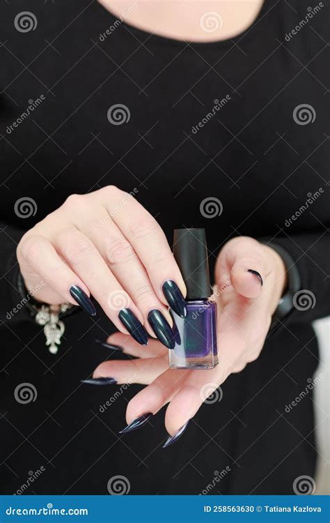 Female Hand Long Nails Holds