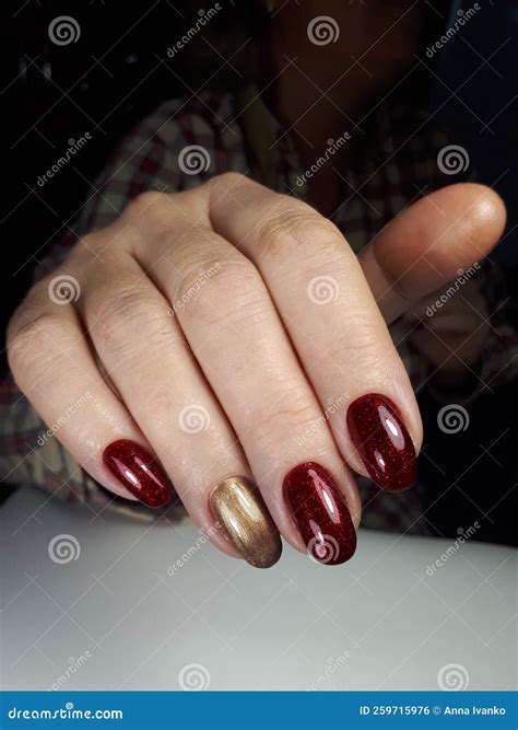 Female Hand Manicured Nails Golden