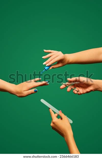 Female Hand Painting Nails Blue