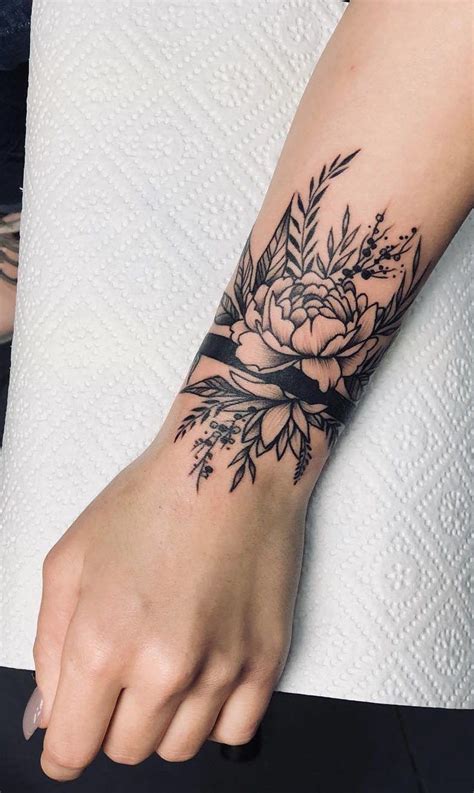 30 Delicate Flower Tattoo Ideas Unique wrist tattoos
