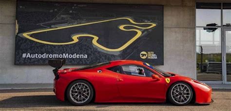 A Ferrari driving through a tunnel on a scenic Italian road