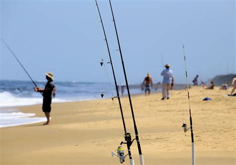 Fisherman catching a fish in Va Beach