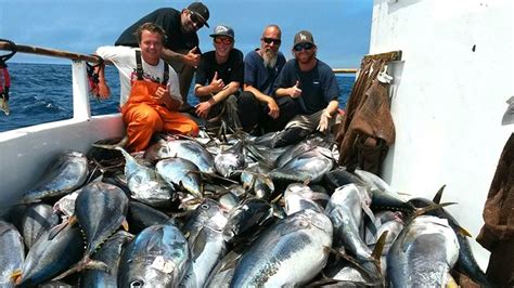 Fishermen with their catches at Davey's Locker