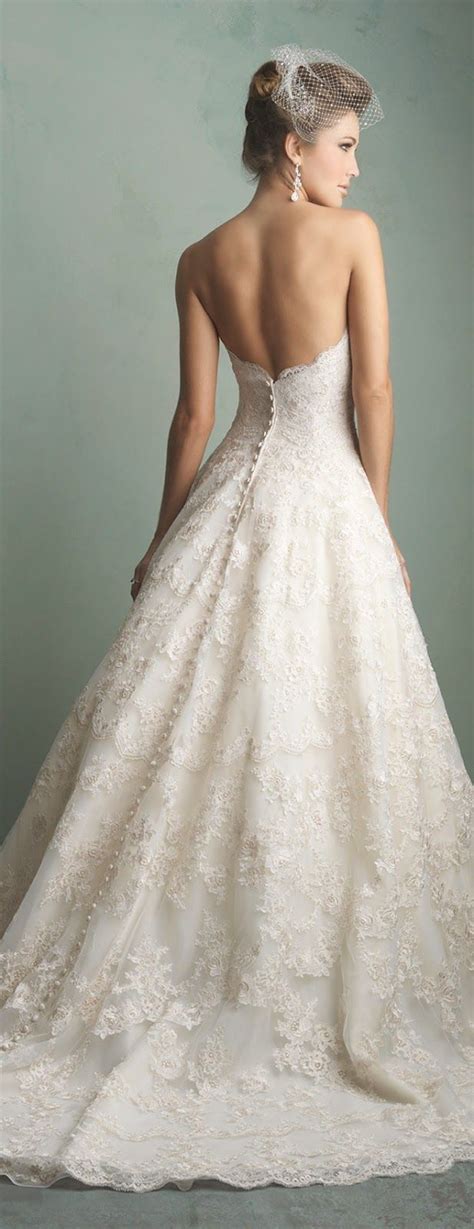 Elegant Perfection: Experience the Timeless Charm of a Fitted Wedding Dress with Alluring Button Detailing on the Back