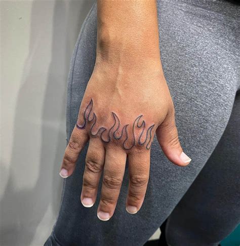Flame Finger Tattoo