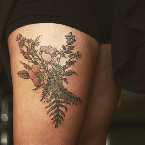 floral tattoo on the thigh