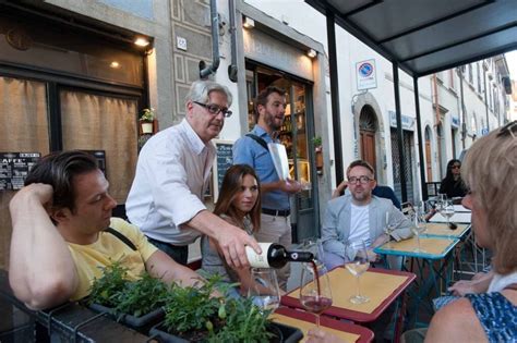 Small group of tourists enjoying a guided coffee tour in Florence.