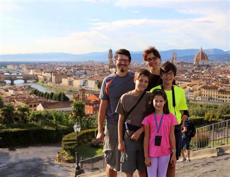 A family exploring Florence with a guide, showcasing their genuine excitement