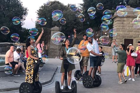 A group of tourists with a tour guide on Segways