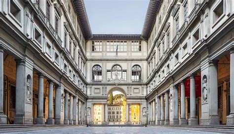 A queue of people eagerly entering the Uffizi Gallery, one of Florence's renowned museums.