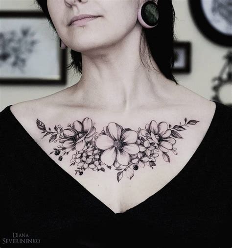 Flower tattoo on collarbone blackwork by Yuliya Lintu