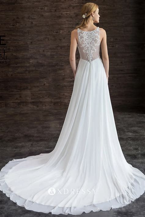 Here are three different title options:1. Graceful Romance: Unleash Mesmerizing Elegance in a Flowy Wedding Dress with Train2. Sweeping Beauty: Look Gorgeous and Majestic in a Flowy Wedding Gown with Long Train3. Enchanted Fairytale: Bring Your Dreams to Life in a Flowy Wedding Dress with Lavish Train