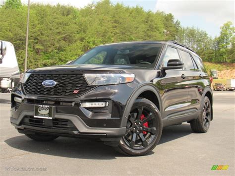 A Ford Explorer ST in Agate Black, parked in a modern urban setting, highlighting its sleek and powerful design.
