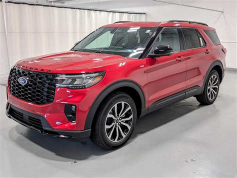 A dynamic shot of a Ford Explorer ST in Rapid Red, captured in motion, emphasizing its speed and vibrant color.
