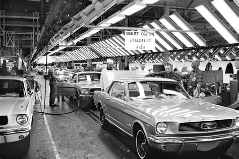 Ford Mustang assembly line workers installing parts